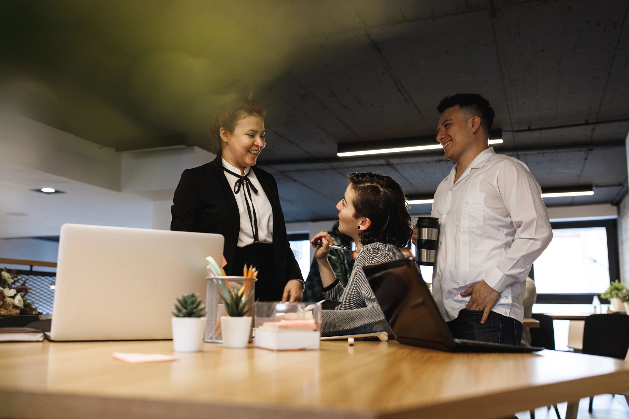 Team members in discussion after a meeting